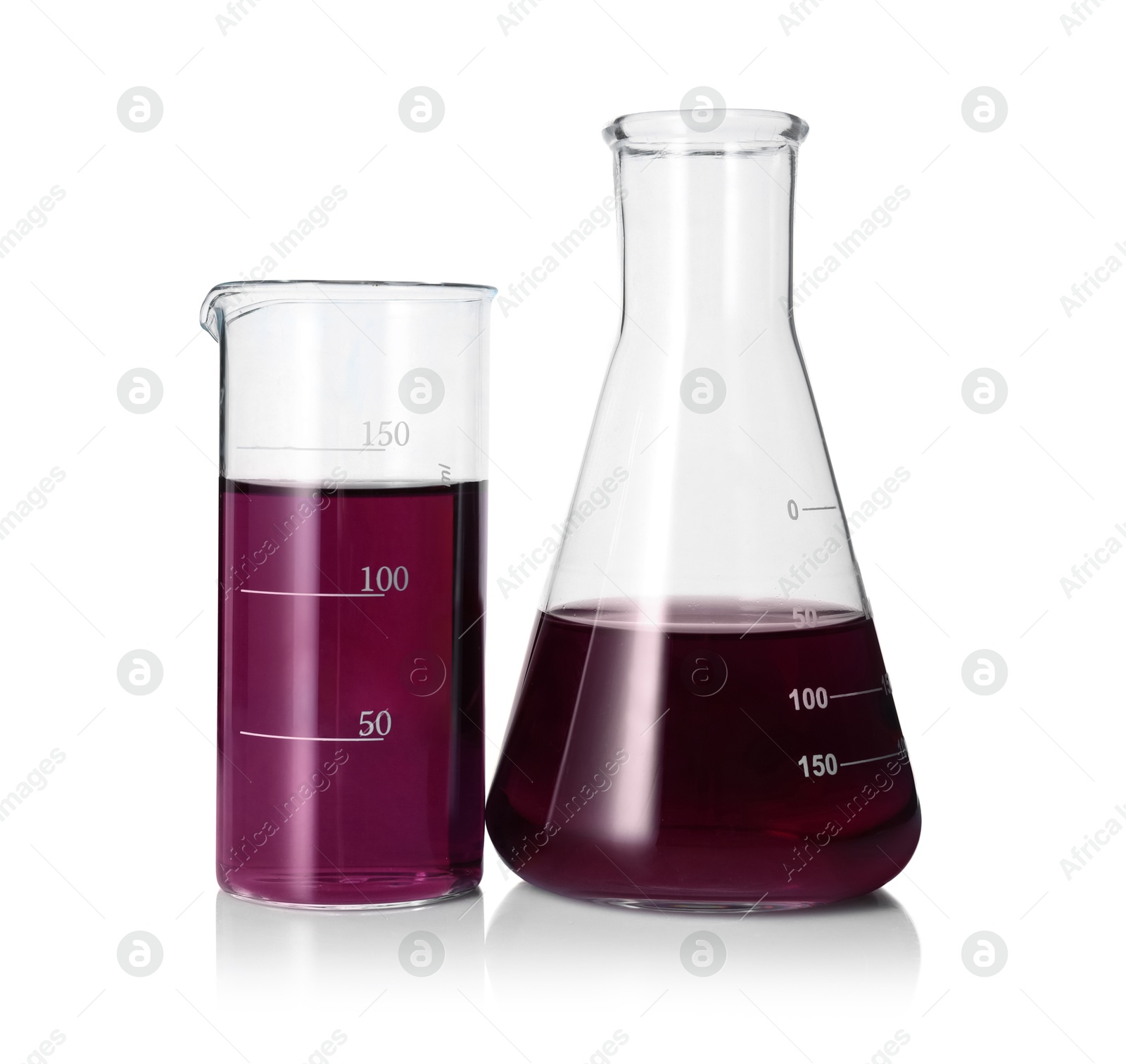 Photo of Different laboratory glassware with color liquid isolated on white