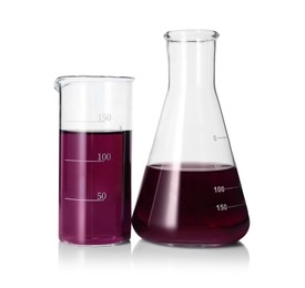 Photo of Different laboratory glassware with color liquid isolated on white