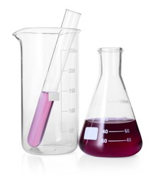 Photo of Different laboratory glassware with color liquid isolated on white