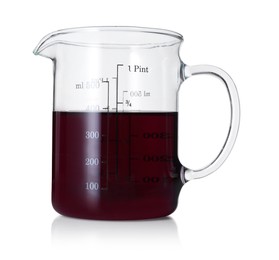 Photo of Measuring cup with color liquid isolated on white