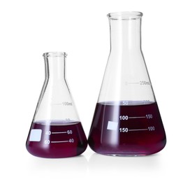 Photo of Different laboratory glassware with color liquid isolated on white
