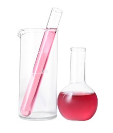 Photo of Different laboratory glassware with red liquid isolated on white