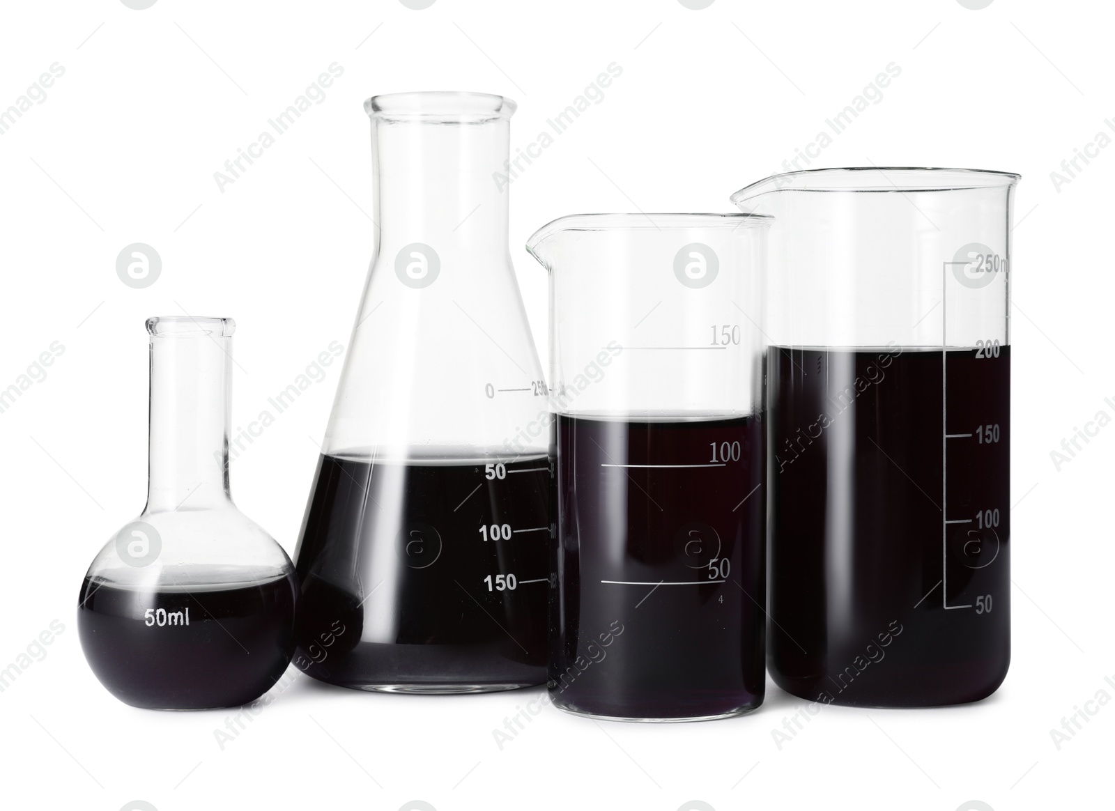 Photo of Different laboratory glassware with black liquid isolated on white
