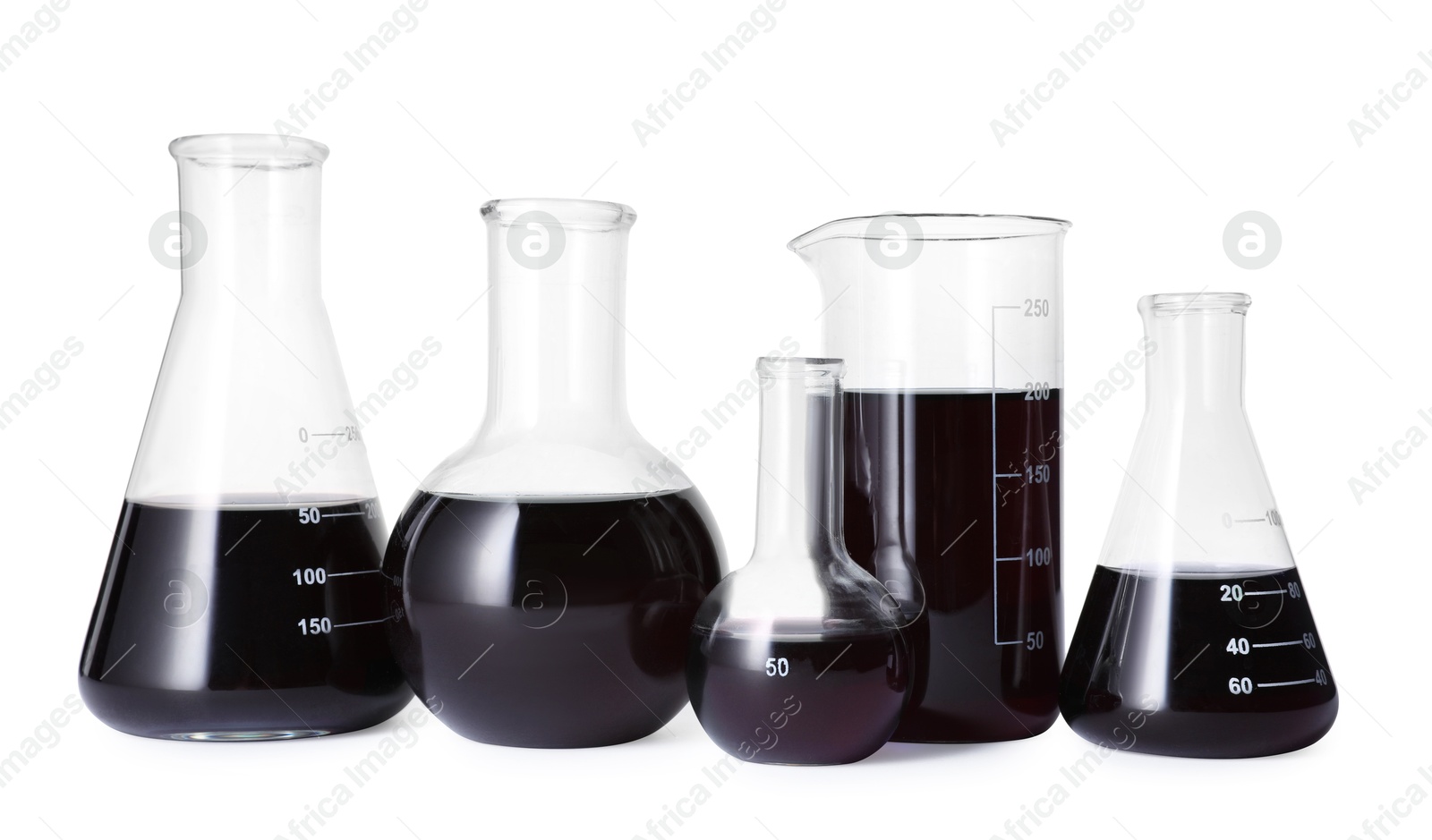Photo of Different laboratory glassware with black liquid isolated on white