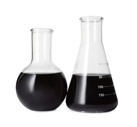 Photo of Different laboratory glassware with black liquid isolated on white