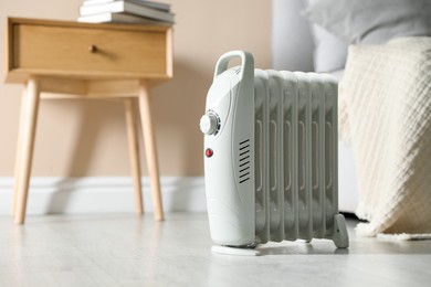 Photo of Electric heater on floor indoors, space for text