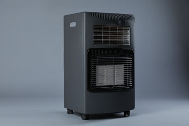 Photo of One electric heater on grey background. Domestic appliance