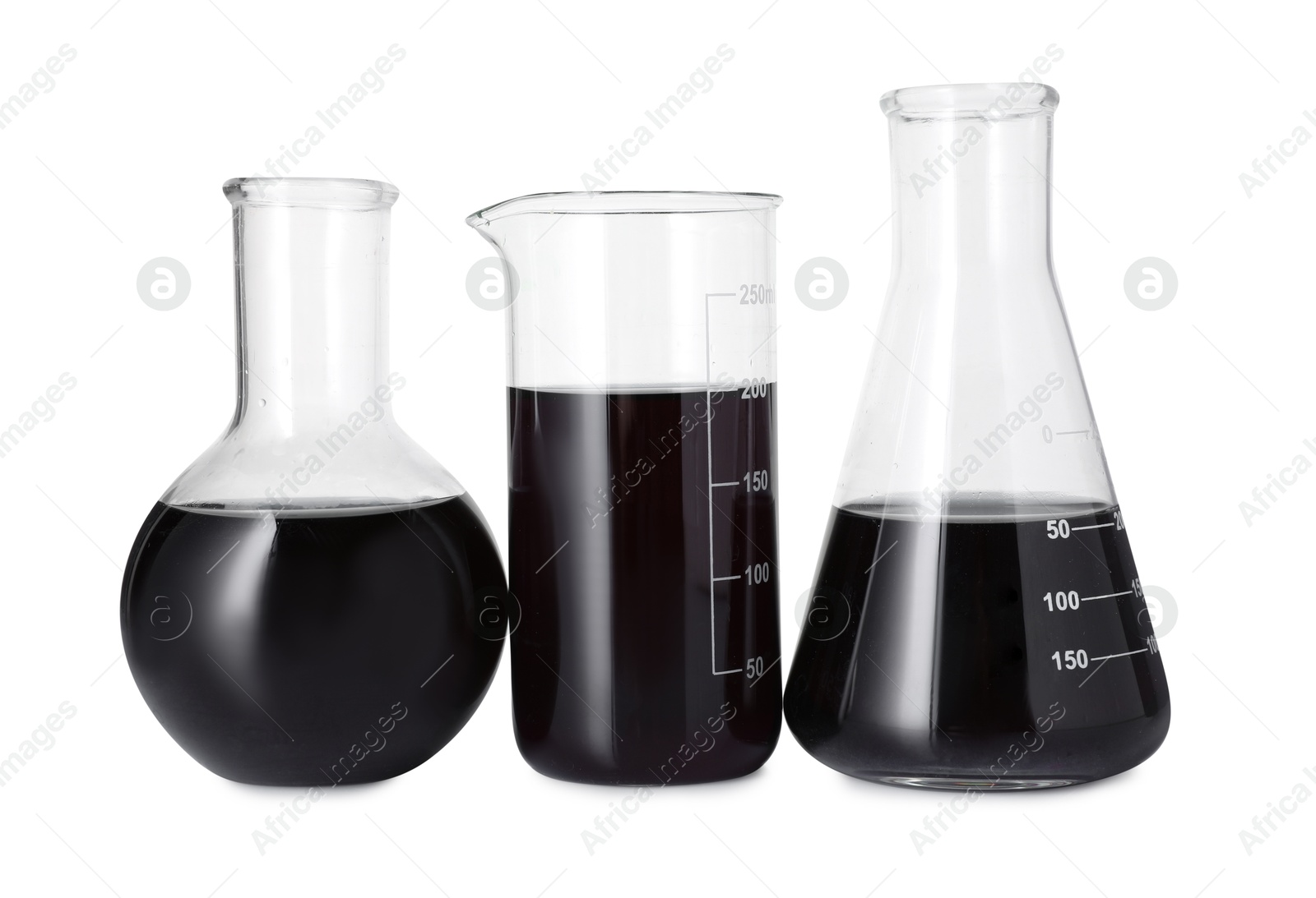 Photo of Different laboratory glassware with black liquid isolated on white