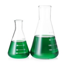 Photo of Different laboratory glassware with green liquid isolated on white
