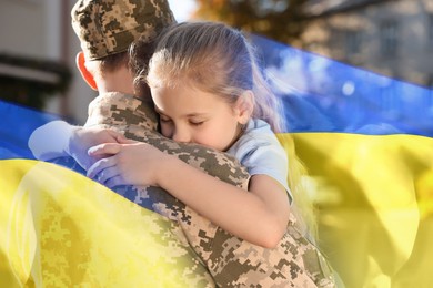 Image of Military man and his happy daughter outdoors. Double exposure with flag of Ukraine
