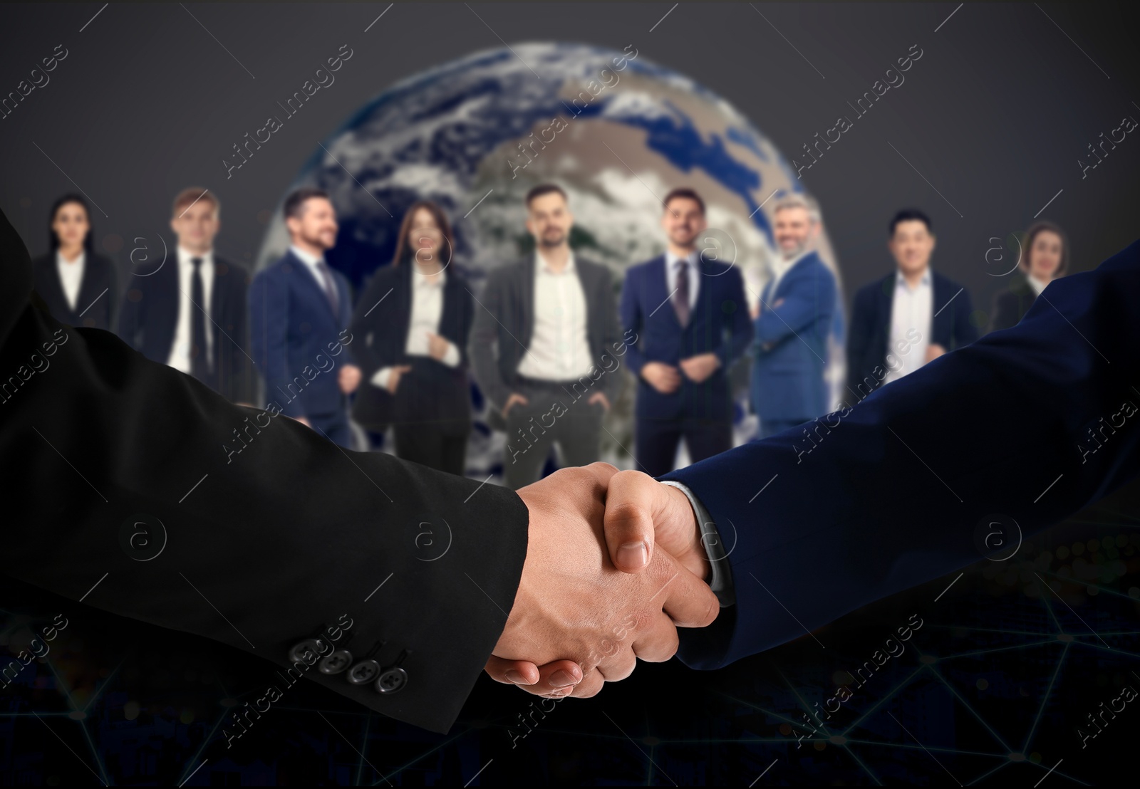 Image of Business partners shaking hands against group of people. Globe on background
