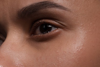 Photo of Closeup view of sad young woman crying