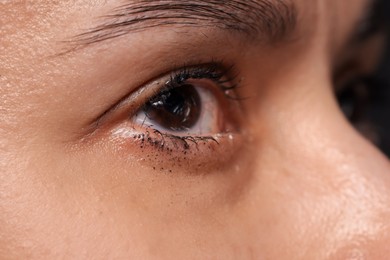 Photo of Closeup view of sad young woman crying