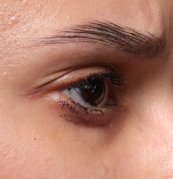 Photo of Closeup view of sad young woman crying