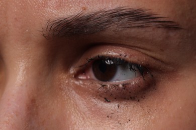 Photo of Closeup view of sad young woman crying