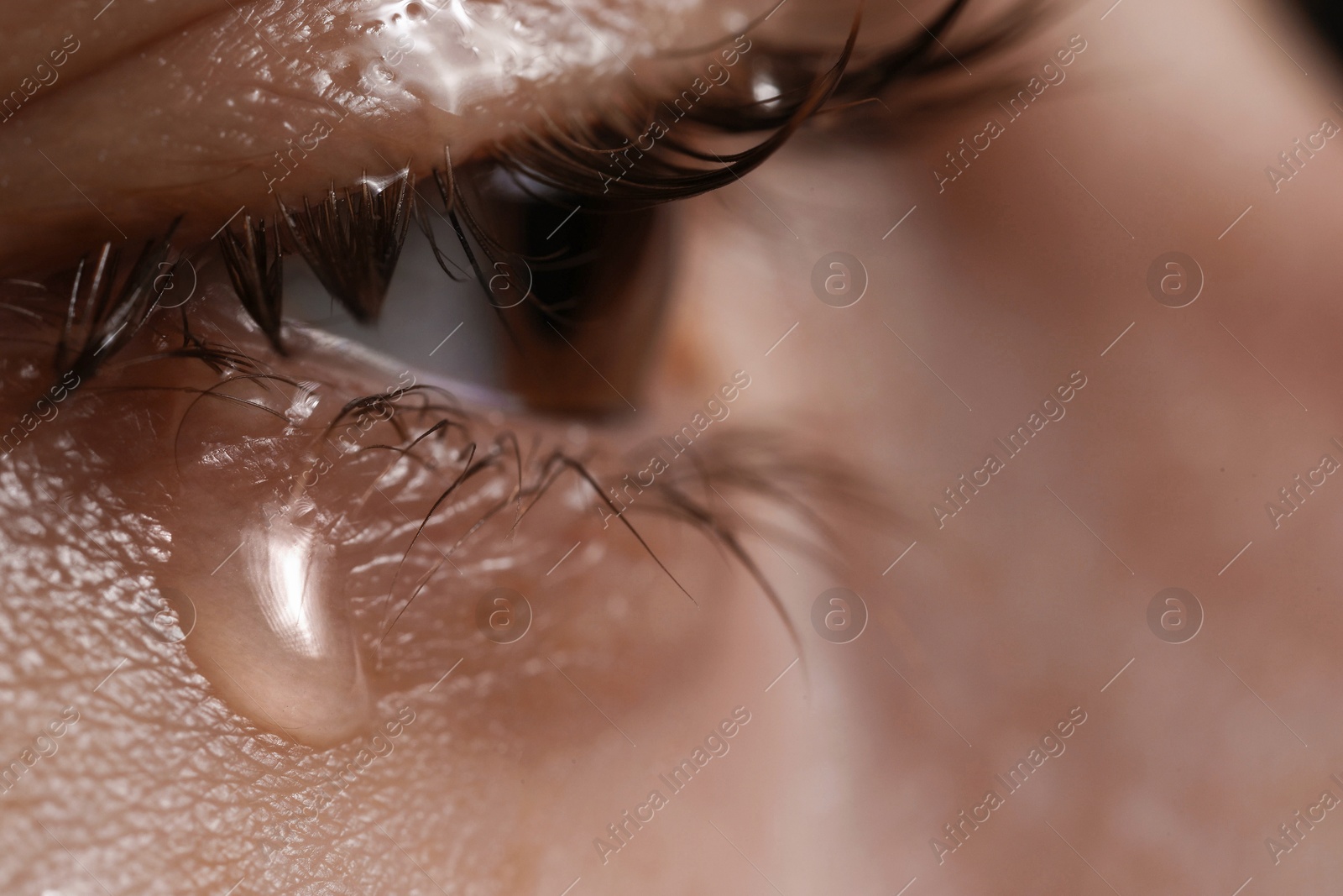 Photo of Closeup view of sad woman crying, space for text