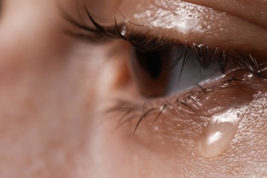 Photo of Closeup view of sad woman crying, space for text