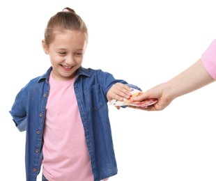 Photo of Mother giving her daughter pocket money on white background, closeup
