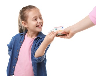 Photo of Mother giving her daughter pocket money on white background, closeup