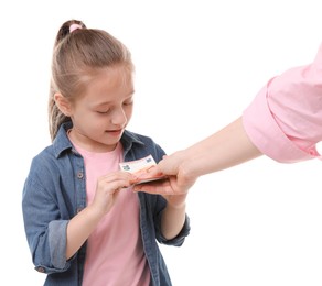 Photo of Mother giving her daughter pocket money on white background, closeup