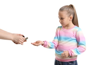 Photo of Mother giving her daughter pocket money on white background, closeup