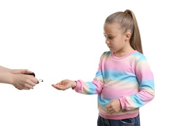 Photo of Mother giving her daughter pocket money on white background, closeup