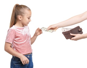 Photo of Mother giving her daughter pocket money on white background, closeup