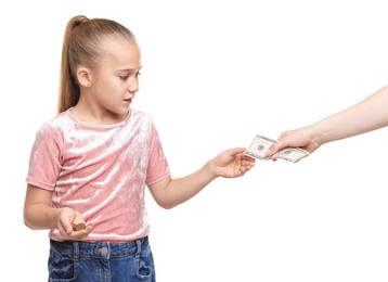 Photo of Mother giving her daughter pocket money on white background, closeup
