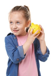 Photo of Pocket money. Little girl with piggy bank on white background