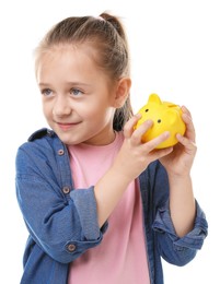 Photo of Pocket money. Little girl with piggy bank on white background