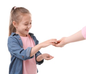 Photo of Mother giving her daughter pocket money on white background, closeup