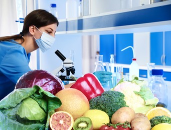 Image of Food analysis. Laboratory worker examining samples of fresh products
