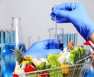 Image of Food analysis. Laboratory worker examining quality of fresh products