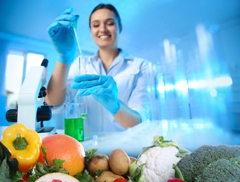 Image of Food analysis. Laboratory worker examining quality of fresh products