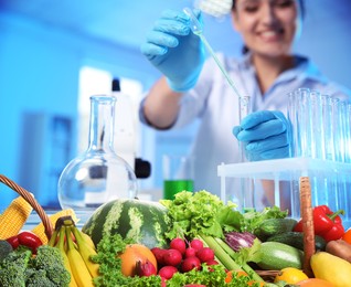 Image of Food analysis. Laboratory worker examining quality of fresh products