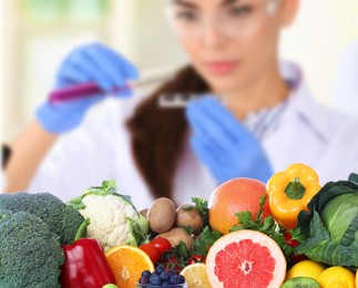 Image of Food analysis. Laboratory worker examining quality of fresh products