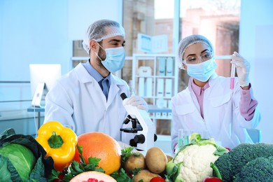 Image of Food analysis. Laboratory worker examining quality of fresh products