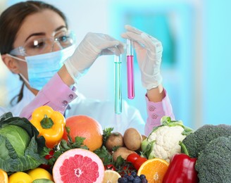 Image of Food analysis. Laboratory worker examining quality of fresh products