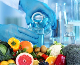 Image of Food analysis. Laboratory worker examining quality of fresh products