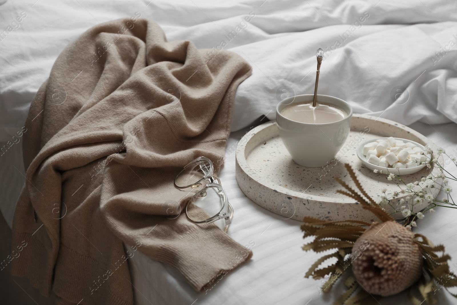 Photo of Composition with soft cashmere sweater on bed at home
