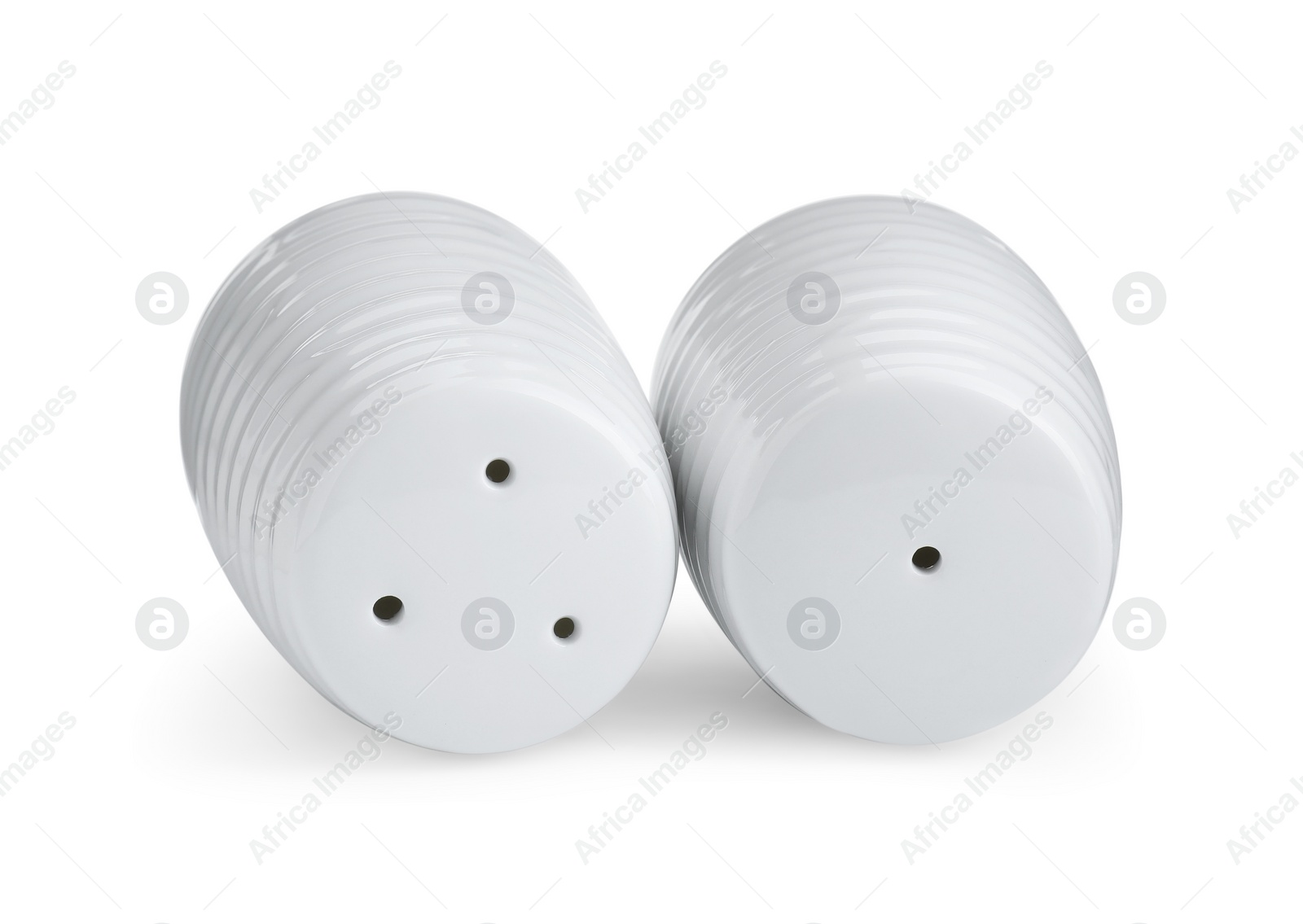 Photo of Salt and pepper shakers isolated on white