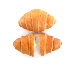 Photo of Delicious croissants with cream on white background, top view