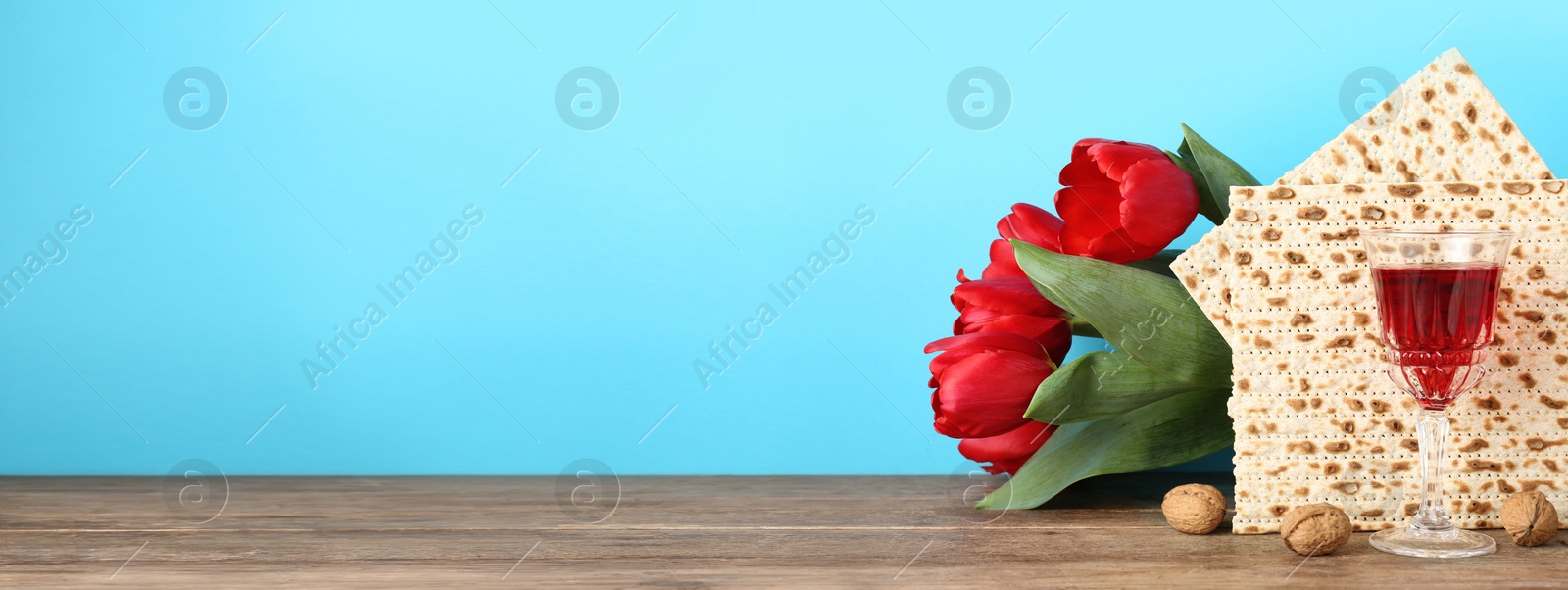 Image of Composition with Passover matzos on wooden table, space for text. Pesach celebration