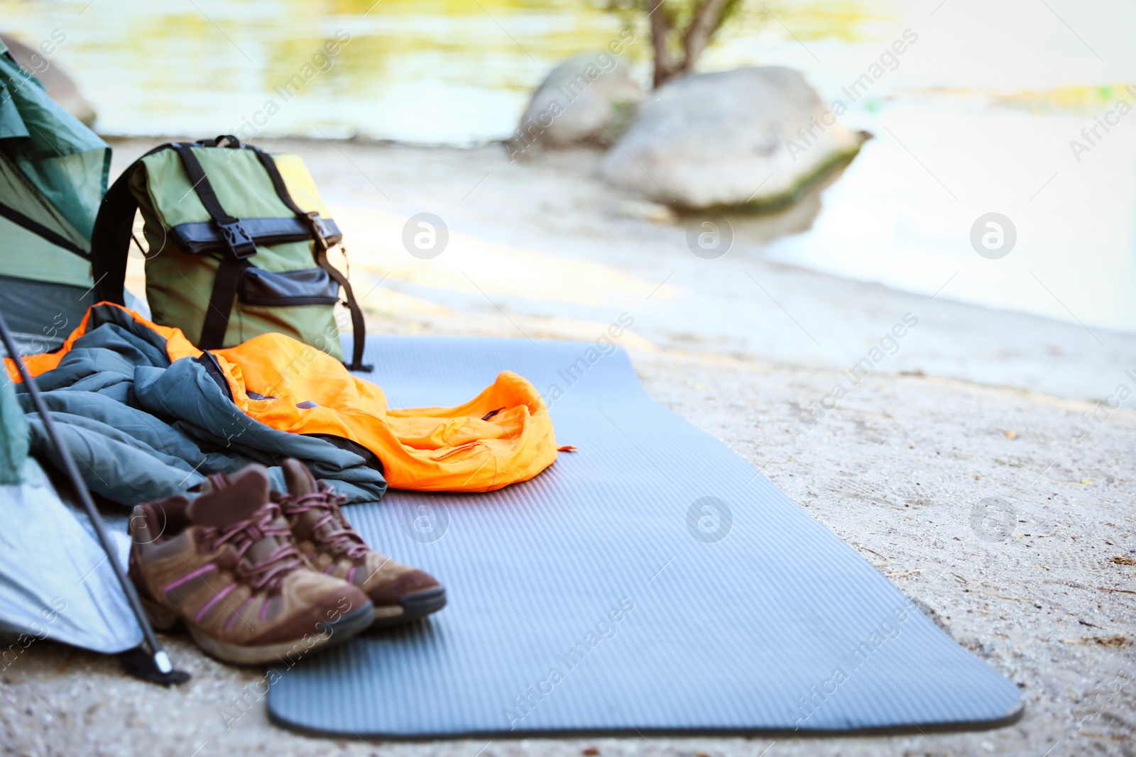 Photo of Sleeping bag and other camping gear outdoors