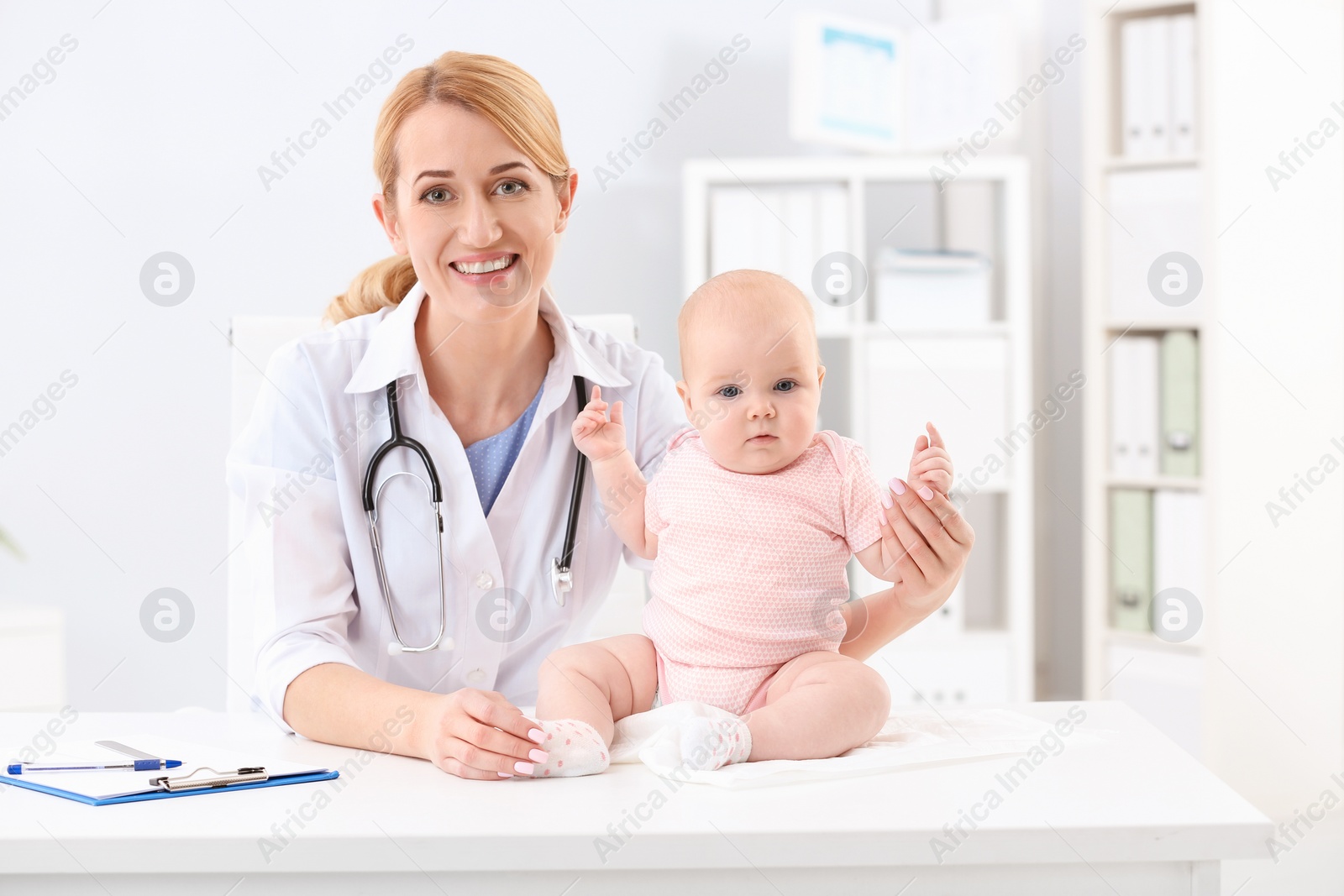 Photo of Children's doctor with cute baby in hospital