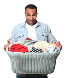 Emotional man with basket full of laundry on white background