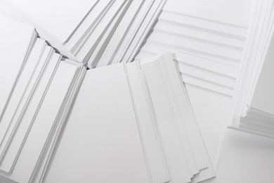 Photo of White paper sheets as background, top view