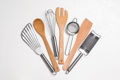 Set of cooking utensils on white background, flat lay