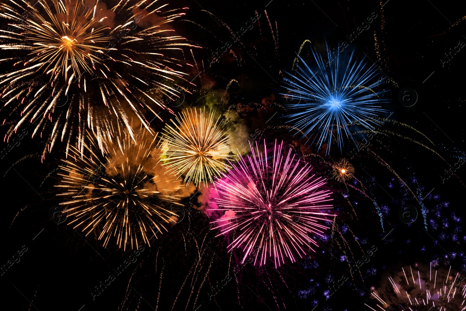 Image of Beautiful bright fireworks lighting up night sky