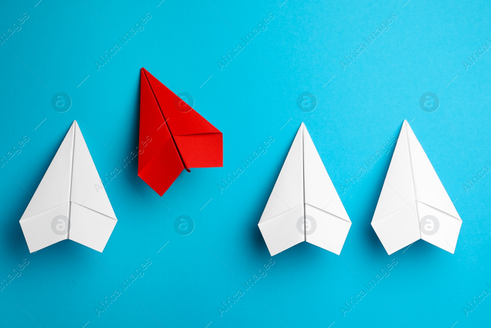 Photo of Flat lay composition with paper planes on light blue background